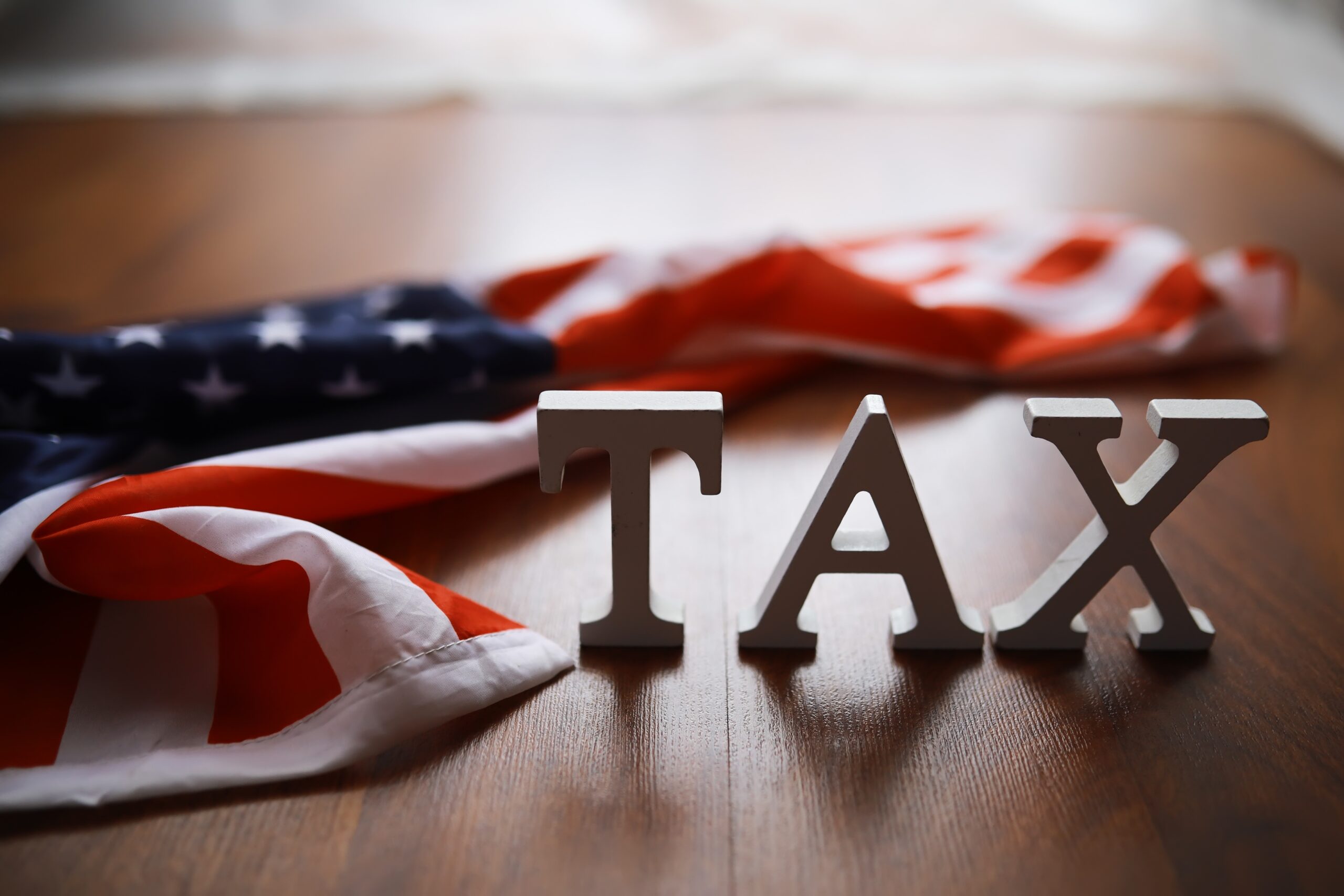 American,Tax,Concept,With,United,States,Flag,And,Tax,Letters